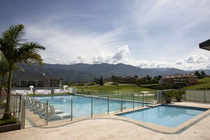 Outdoor pool, open 9:00 AM to 5:00 PM, sun loungers, lifeguards on site