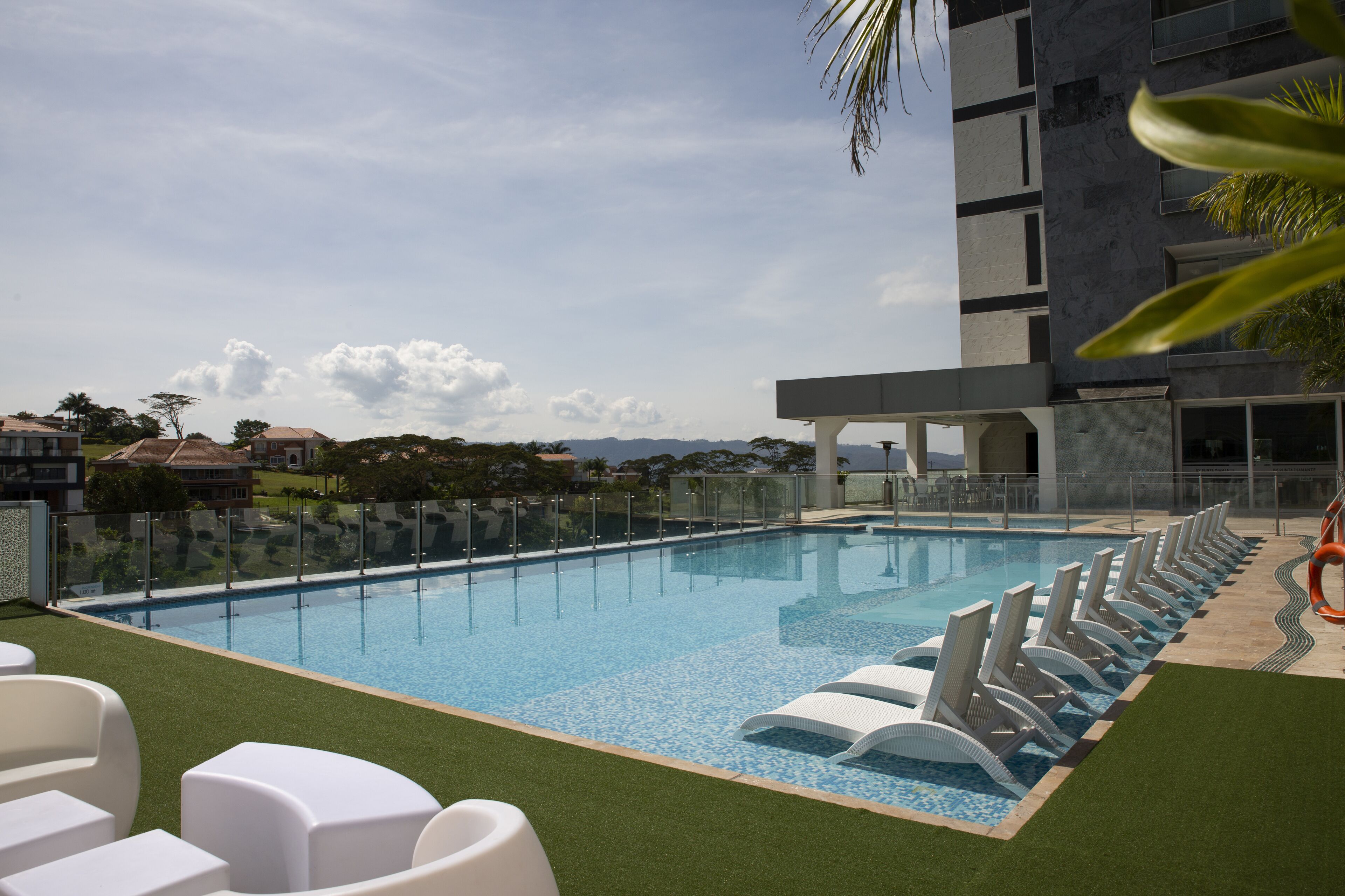 outdoor pool, open 9:00 am to 5:00 pm, pool loungers, lifeguards on site