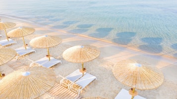 On the beach, beach cabanas, sun-loungers, beach umbrellas