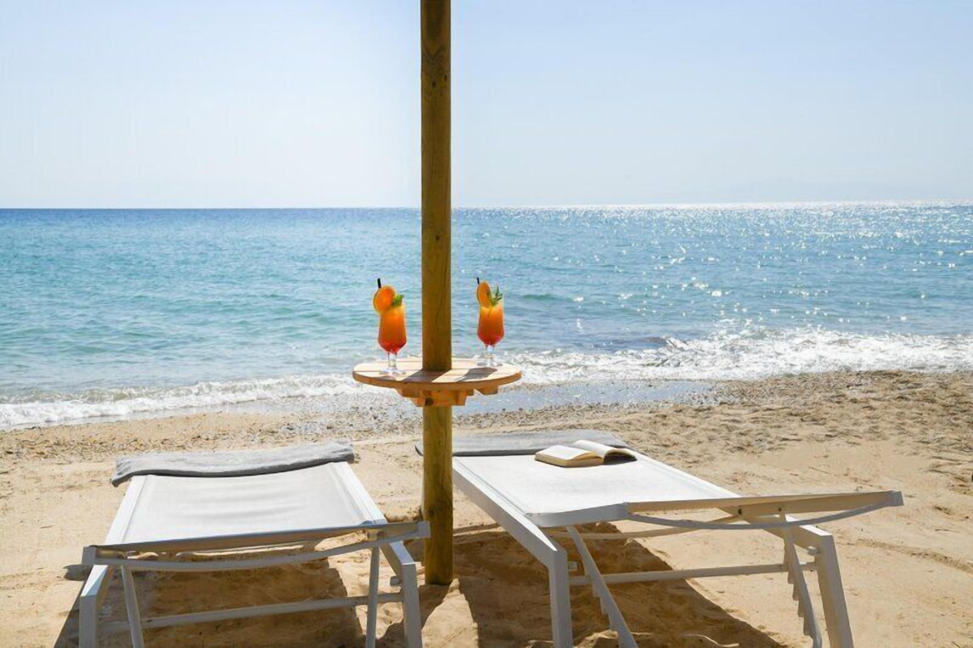 On the beach, beach cabanas, sun loungers, beach umbrellas
