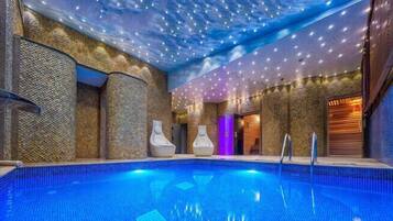 Outdoor pool, an infinity pool, pool umbrellas, pool loungers