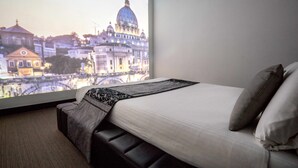 A hotel room with a large window displaying a cityscape view. -  Gueshouse o Affitacamere Magenta Campo dei Fiori  (Rome)