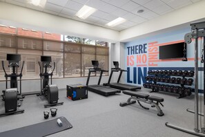 A gym with treadmills, weight machines, dumbbells, and a motivational wall. - Hampton Inn & Suites Roanoke-Downtown (Roanoke)