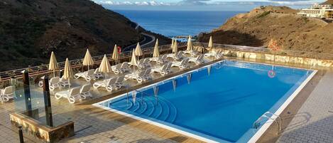 2 outdoor pools, pool umbrellas, pool loungers
