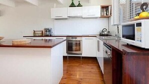 Bayside-St Johns Close | Private kitchen | Fridge, coffee/tea maker, high chair
