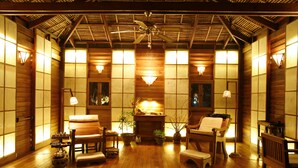 A traditional Japanese-style room with wooden floors, tatami mats, and a ceiling fan. - Inle Lake View Resort & Spa (Nyaungshwe)