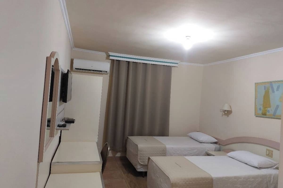 standard twin room (economico) | minibar, in-room safe, desk, blackout curtains