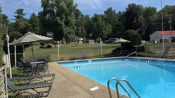 Seasonal outdoor pool, pool umbrellas, pool loungers