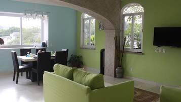 Luxury Double Room, 2 Double Beds | Living area | Flat-screen TV