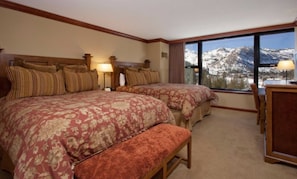 Desk, iron/ironing board, bed sheets