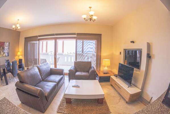 Deluxe Apartment, 2 Bedrooms (Penthouse) | Living area | LCD TV