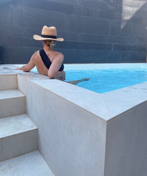 Outdoor pool, a heated pool, sun loungers