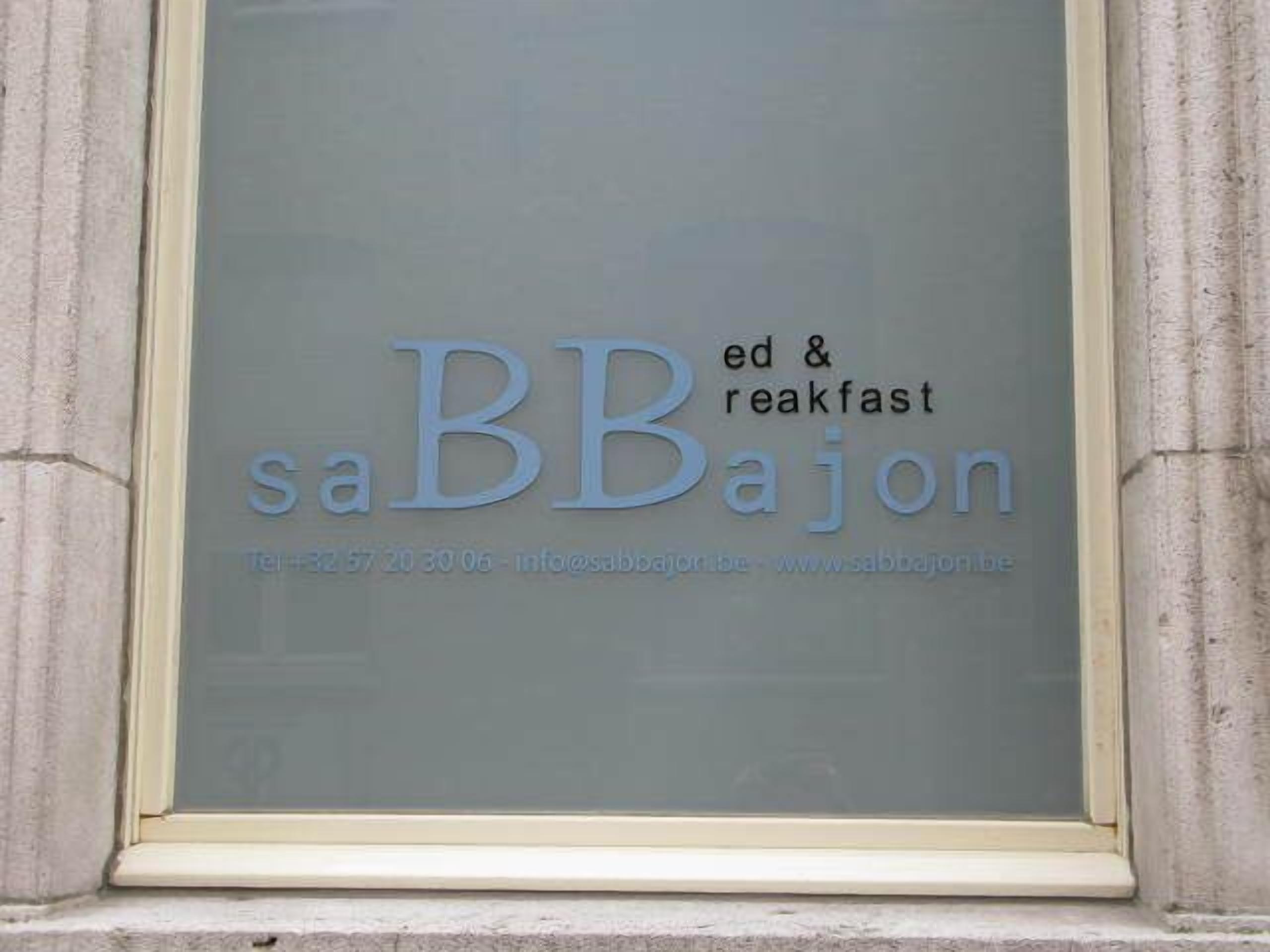 A window with the text "BB breakfast" and "sbbajon" along with a phone number and website URL.