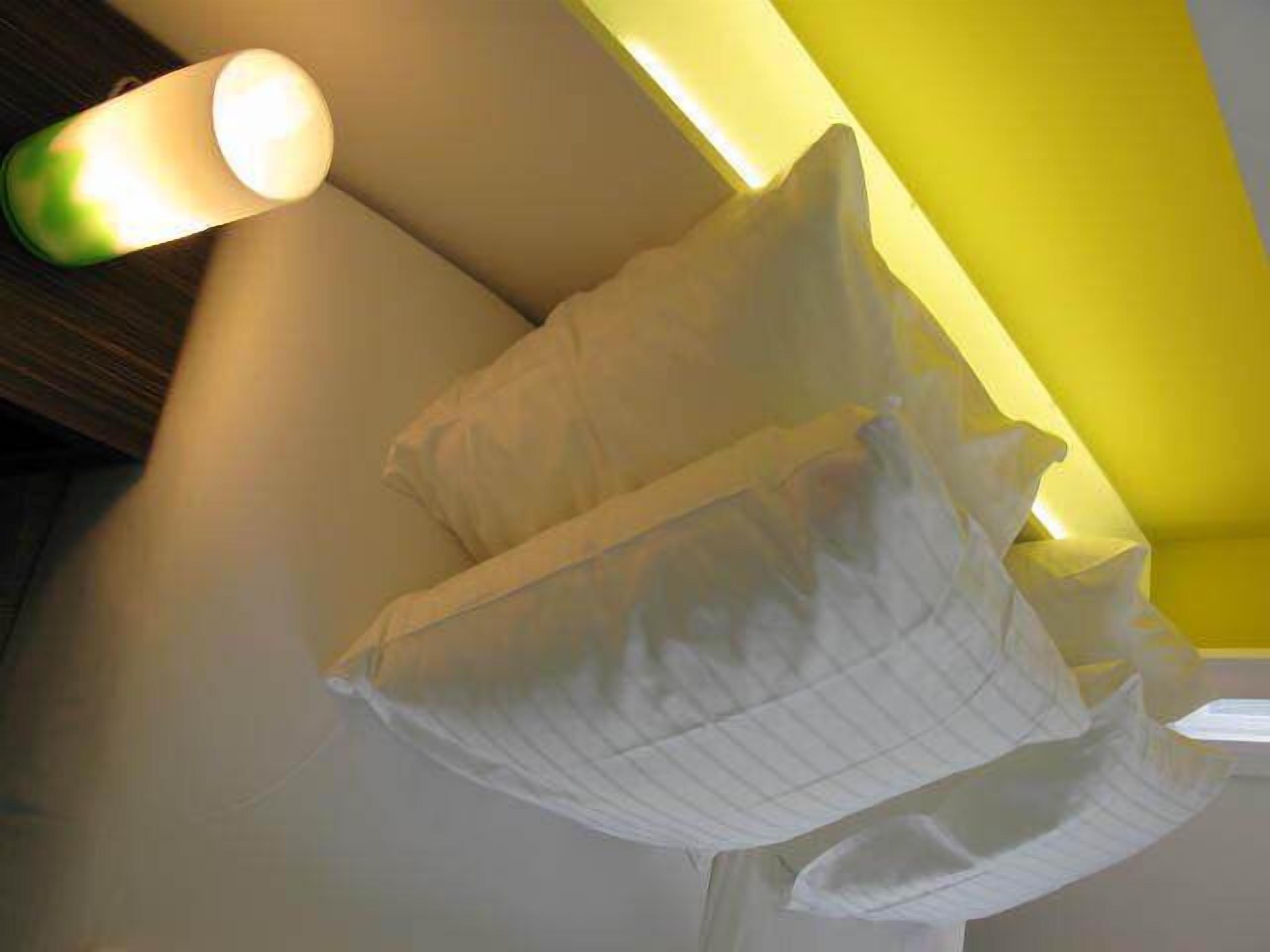 A room with a high ceiling and a sloped roof.