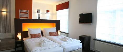 Premium bedding, individually furnished, desk, laptop workspace