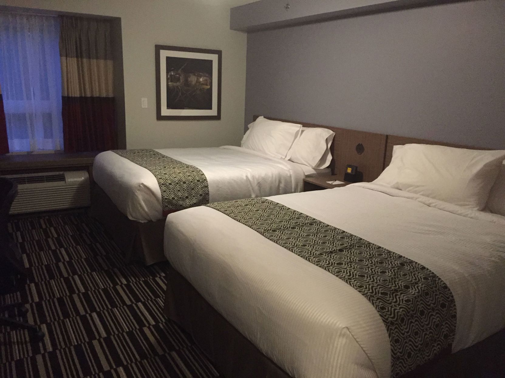 Pillowtop beds, desk, blackout drapes, iron/ironing board