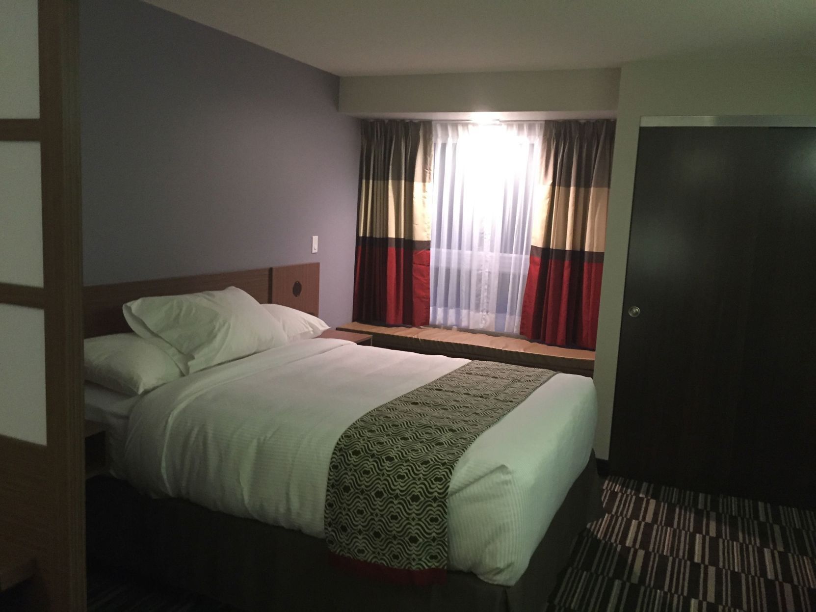 Pillowtop beds, desk, blackout drapes, iron/ironing board