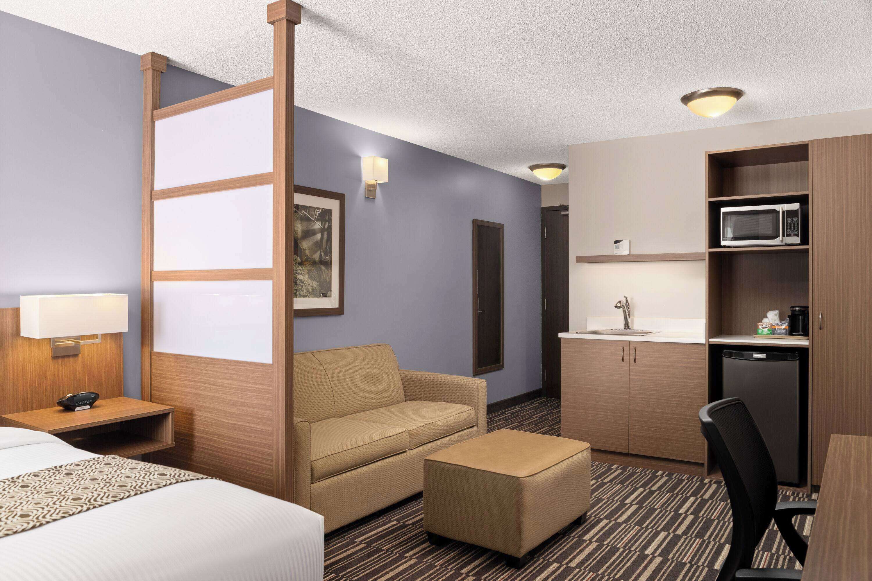 suite, 1 queen bed, non smoking | pillow-top beds, desk, blackout curtains, iron/ironing board
