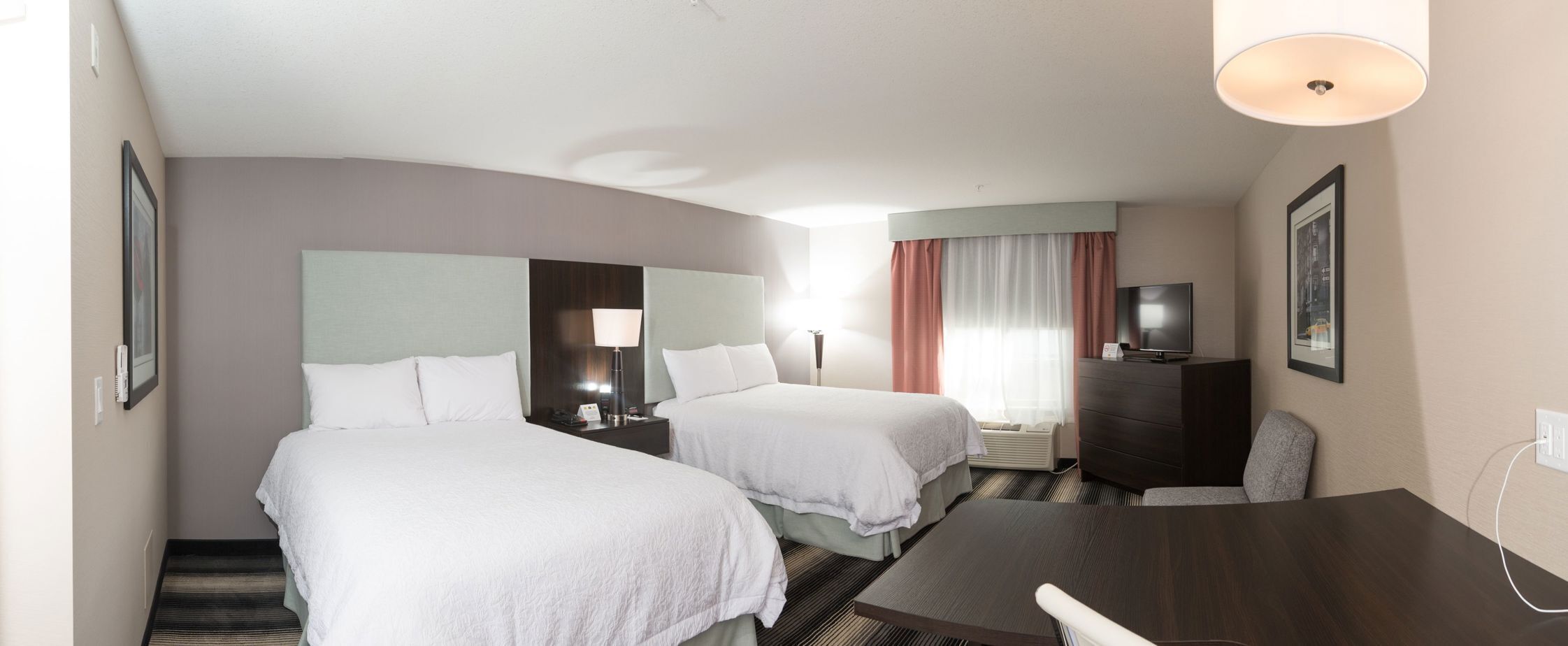 Premium bedding, desk, laptop workspace, iron/ironing board