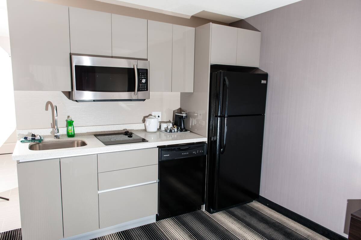suite, 1 king bed, accessible | private kitchenette | full-sized fridge, microwave, stovetop, dishwasher