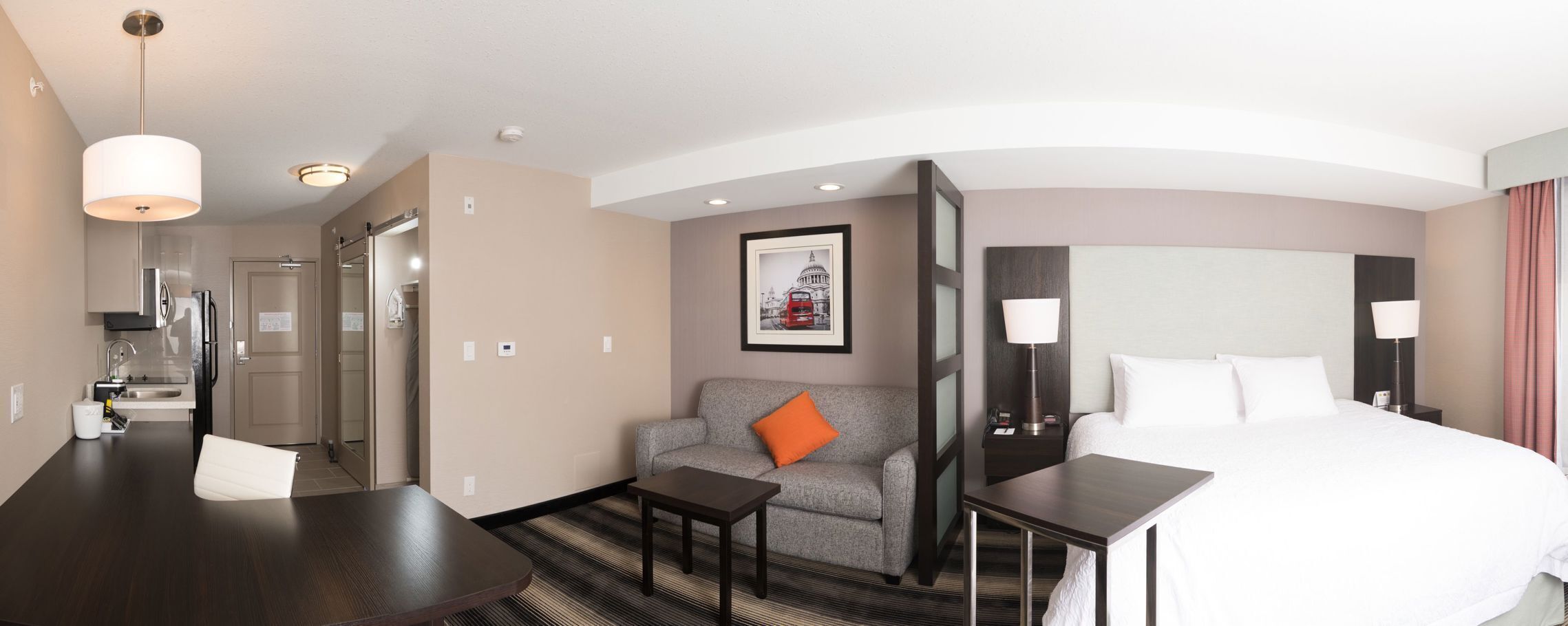 Premium bedding, desk, laptop workspace, iron/ironing board