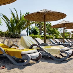 On the beach, beach cabanas, sun-loungers, beach umbrellas