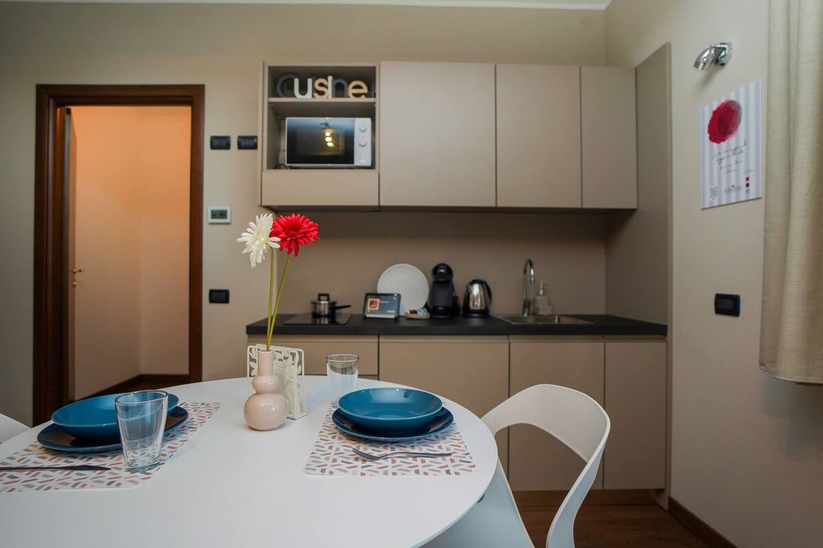 Desk, laptop workspace, blackout drapes, iron/ironing board