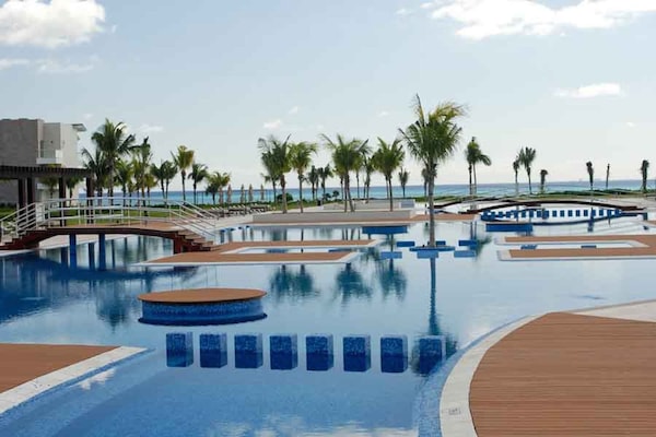 Outdoor pool, open 9 AM to 9 PM, free cabanas, pool umbrellas