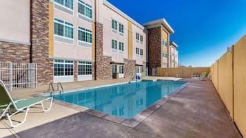 Seasonal outdoor pool, open 7:00 AM to 10:00 PM, sun loungers