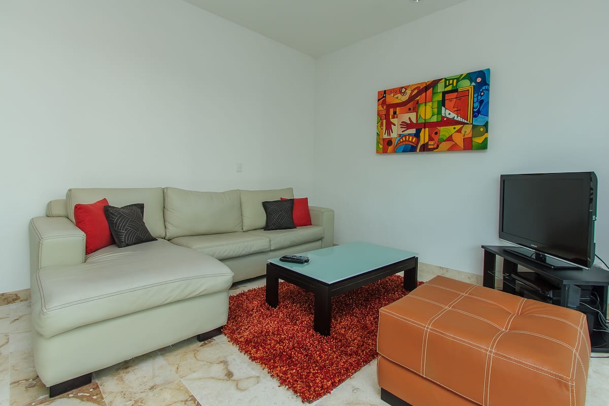 Deluxe Condo, 2 Bedrooms, Non Smoking, Balcony | Living room | Flat-screen TV