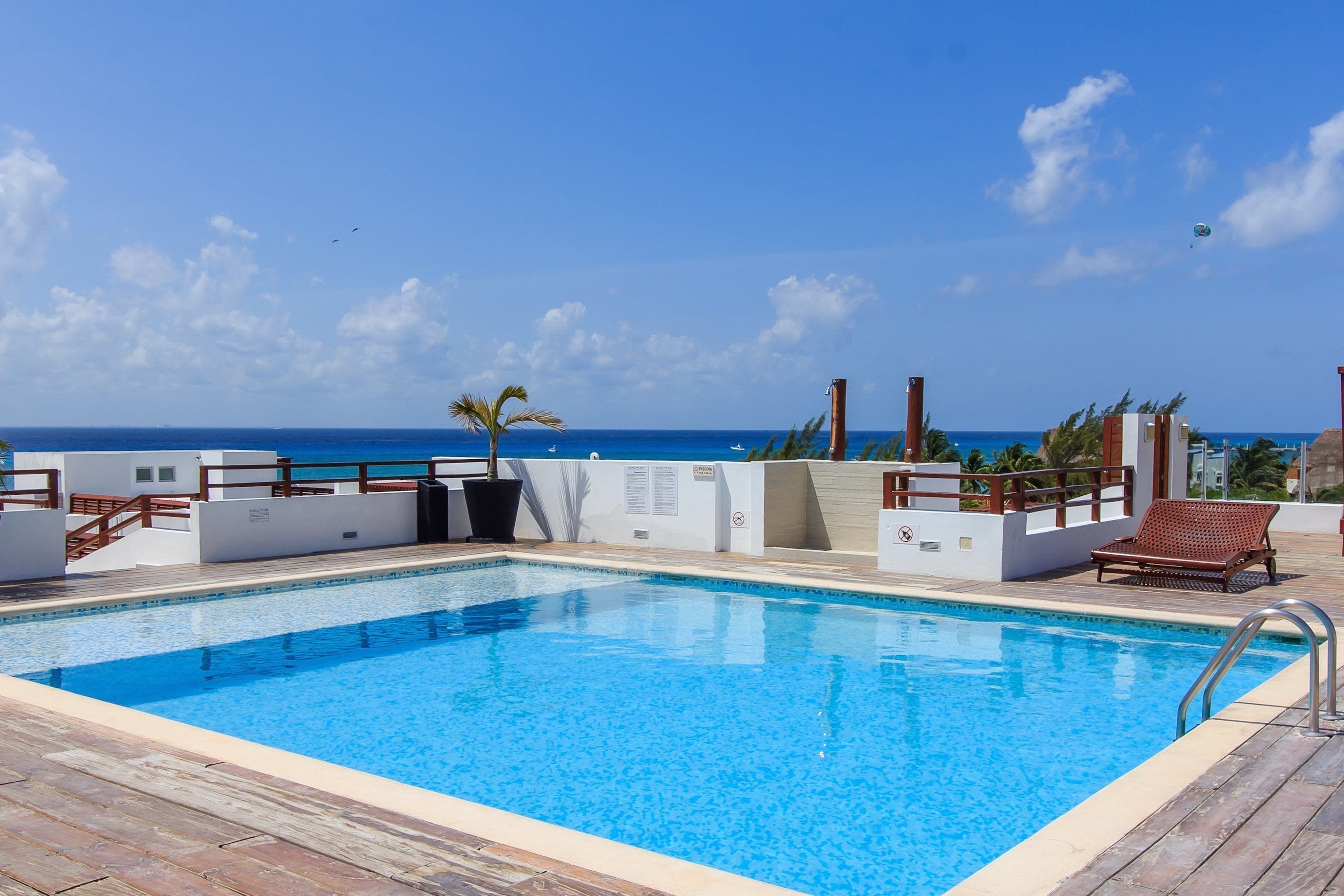 Outdoor pool, a rooftop pool, open 9 AM to 9 PM, sun loungers