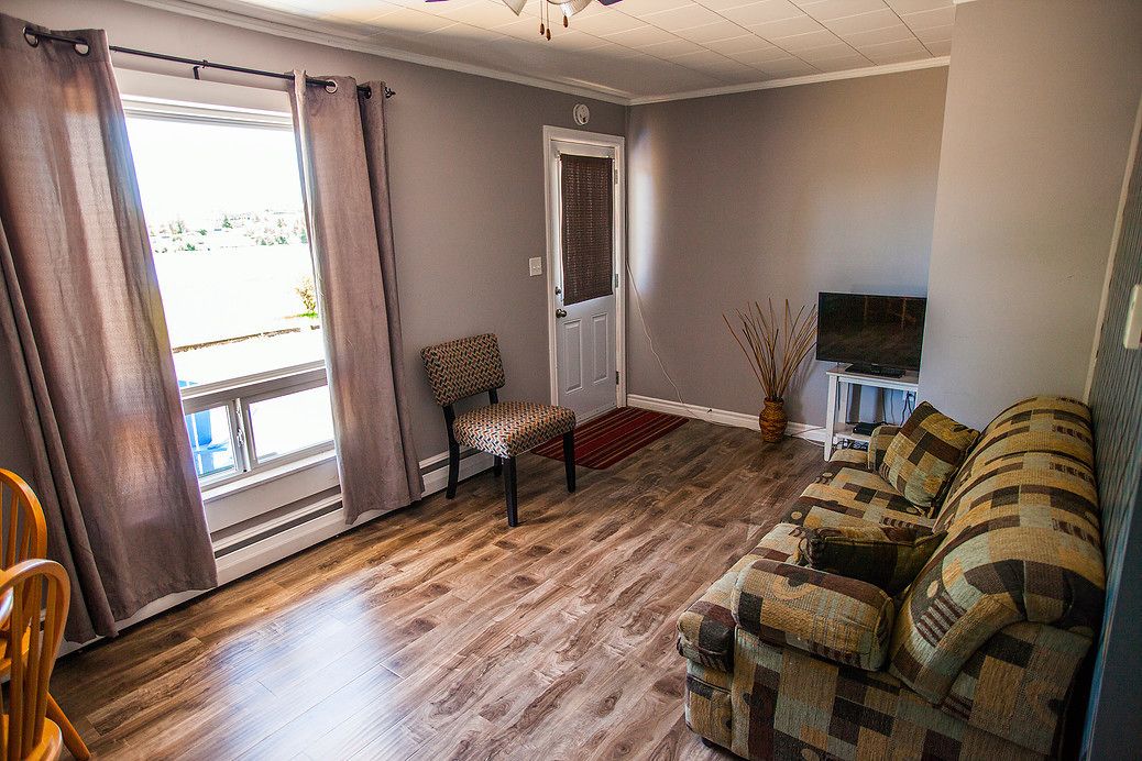 room #2 signature apartment, 1 bedroom | living room | 32-inch flat-screen tv with cable channels, tv