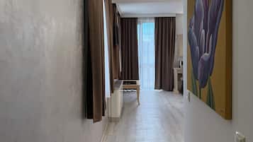 Family Apartment, 1 Bedroom | Minibar, desk, laptop workspace, soundproofing