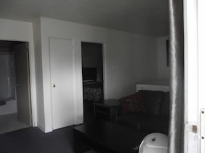 Desk, laptop workspace, blackout curtains, iron/ironing board