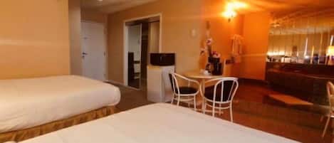 Deluxe Suite, Multiple Beds, Jetted Tub (Fireplace) | Premium bedding, desk, free WiFi, wheelchair access