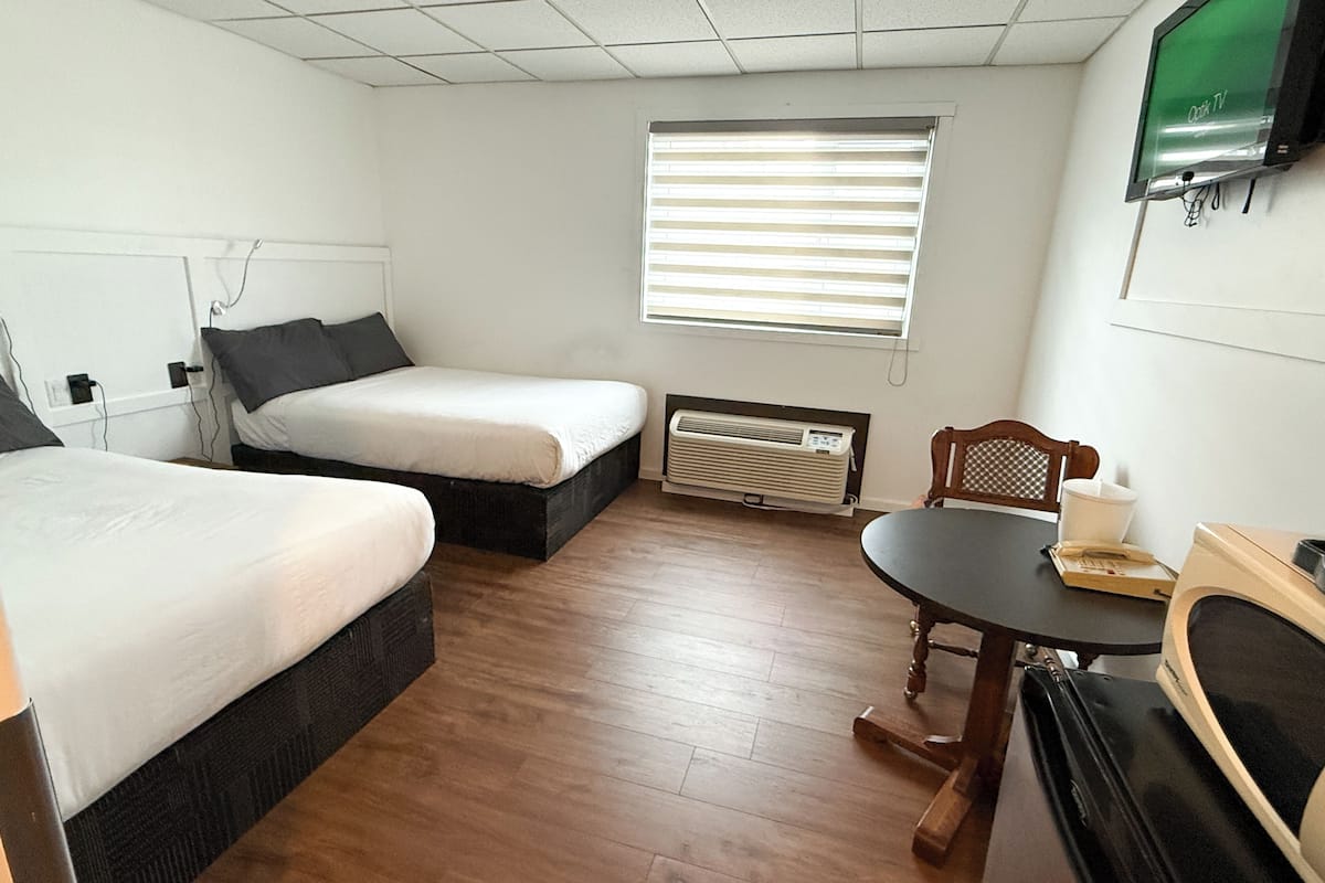 Room, 2 Double Beds | Pillowtop beds, desk, iron/ironing board, WiFi (free)