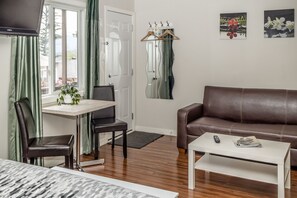 Superior Studio, 1 King Bed | Living area | Flat-screen TV - Crescent Motel (Radium Hot Springs)