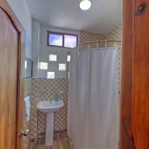 Shower, designer toiletries, towels