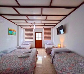 Standard Quadruple Room | 1 bedroom, down comforters, iron/ironing board, free WiFi