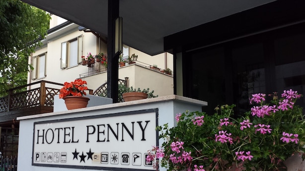 A sign for Hotel Penny with amenities icons, including parking, Wi-Fi, TV, and a keyhole symbol. - Hotel Penny (Rimini)