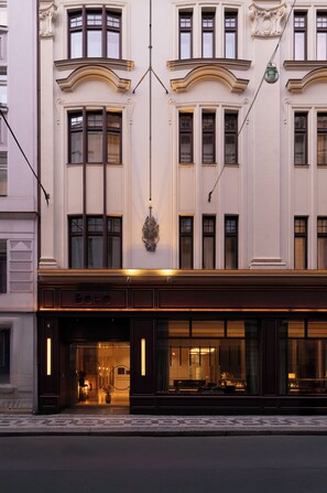 A hotel facade with large windows, a prominent entrance, and a sign reading "BOHO". -  BoHo Prague Hotel, Small Luxury Hotels (Prague)