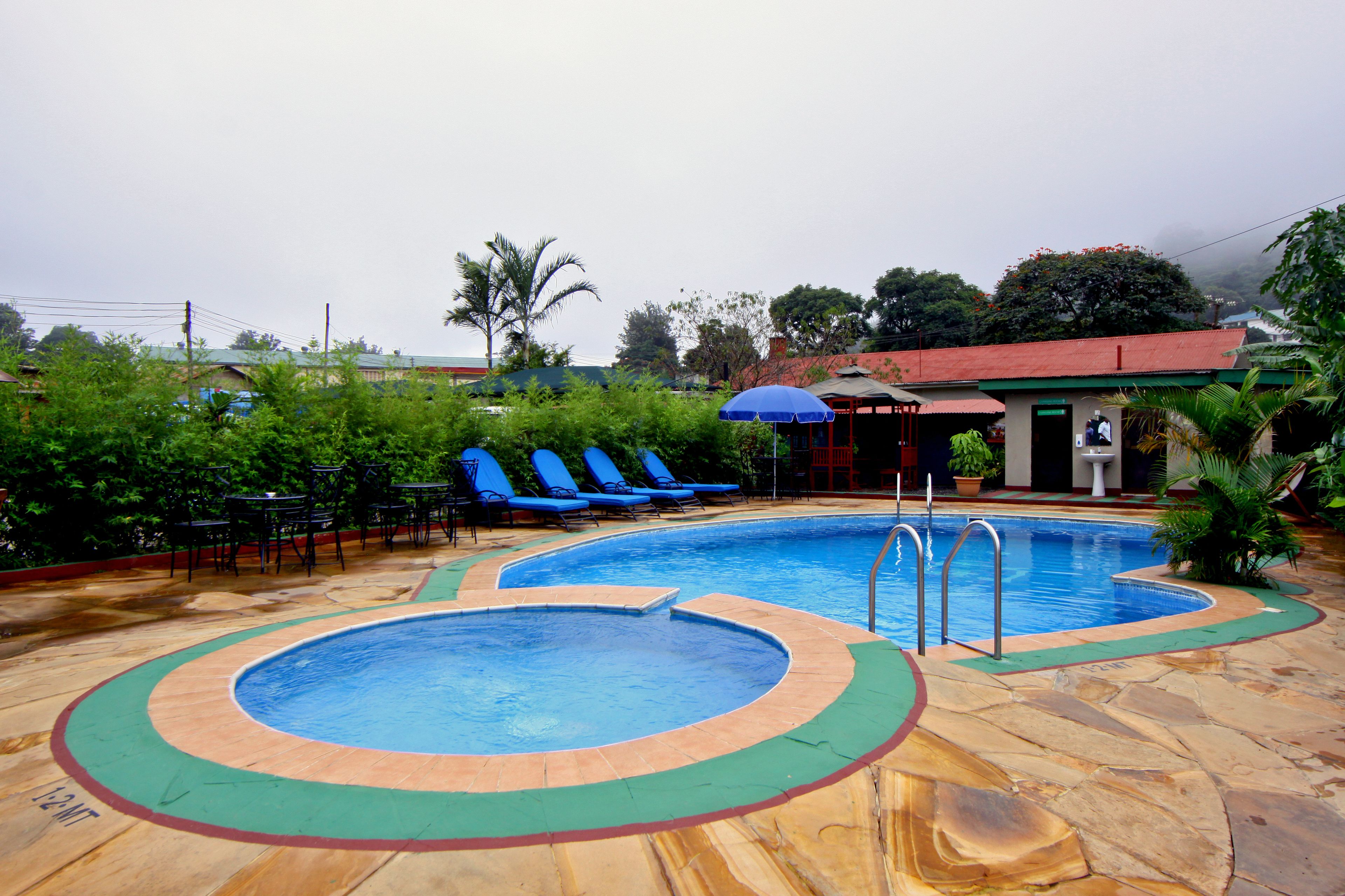Outdoor pool, open 6:00 AM to 7:00 PM, pool umbrellas