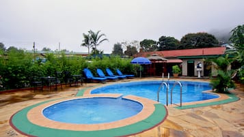 Outdoor pool, open 6:00 AM to 7:00 PM, pool umbrellas
