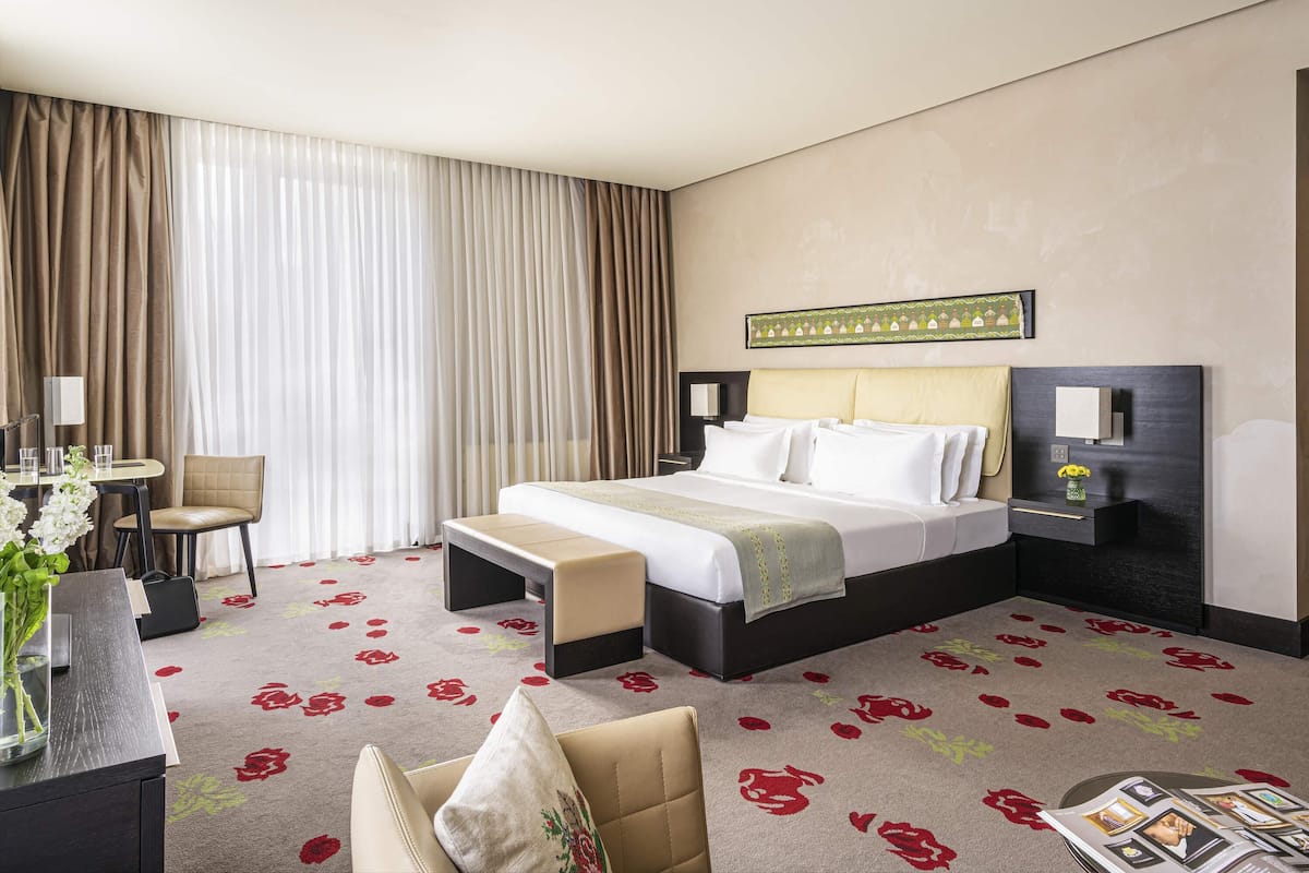 Deluxe Room, 1 King Bed (and Sofa) | Egyptian cotton sheets, premium bedding, memory foam beds, in-room safe
