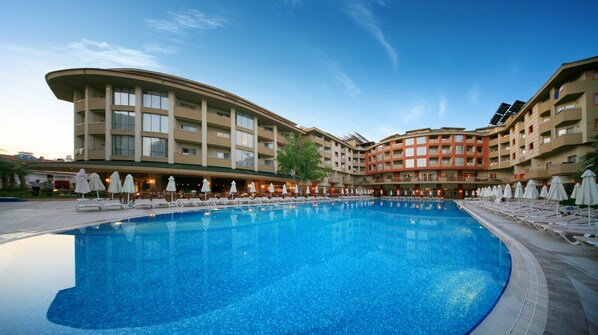 Indoor pool, seasonal outdoor pool, pool umbrellas, sun loungers