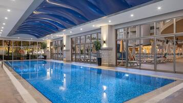 Indoor pool, seasonal outdoor pool, pool umbrellas, pool loungers