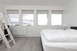 Family Room, Private Bathroom | Desk, laptop workspace, blackout curtains, soundproofing - Kef Guesthouse by Keflavík airport (Reykjanesbær)