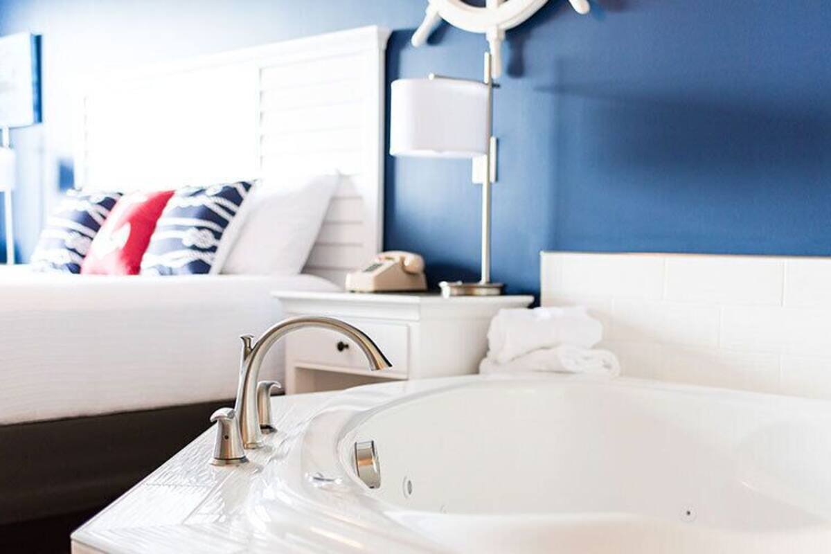 Premium bedding, pillow-top beds, blackout curtains, iron/ironing board