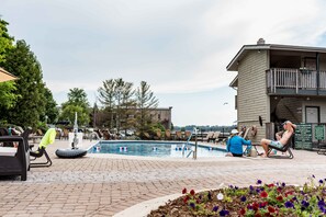 Outdoor pool, open 9:00 AM to 9:00 PM, pool loungers