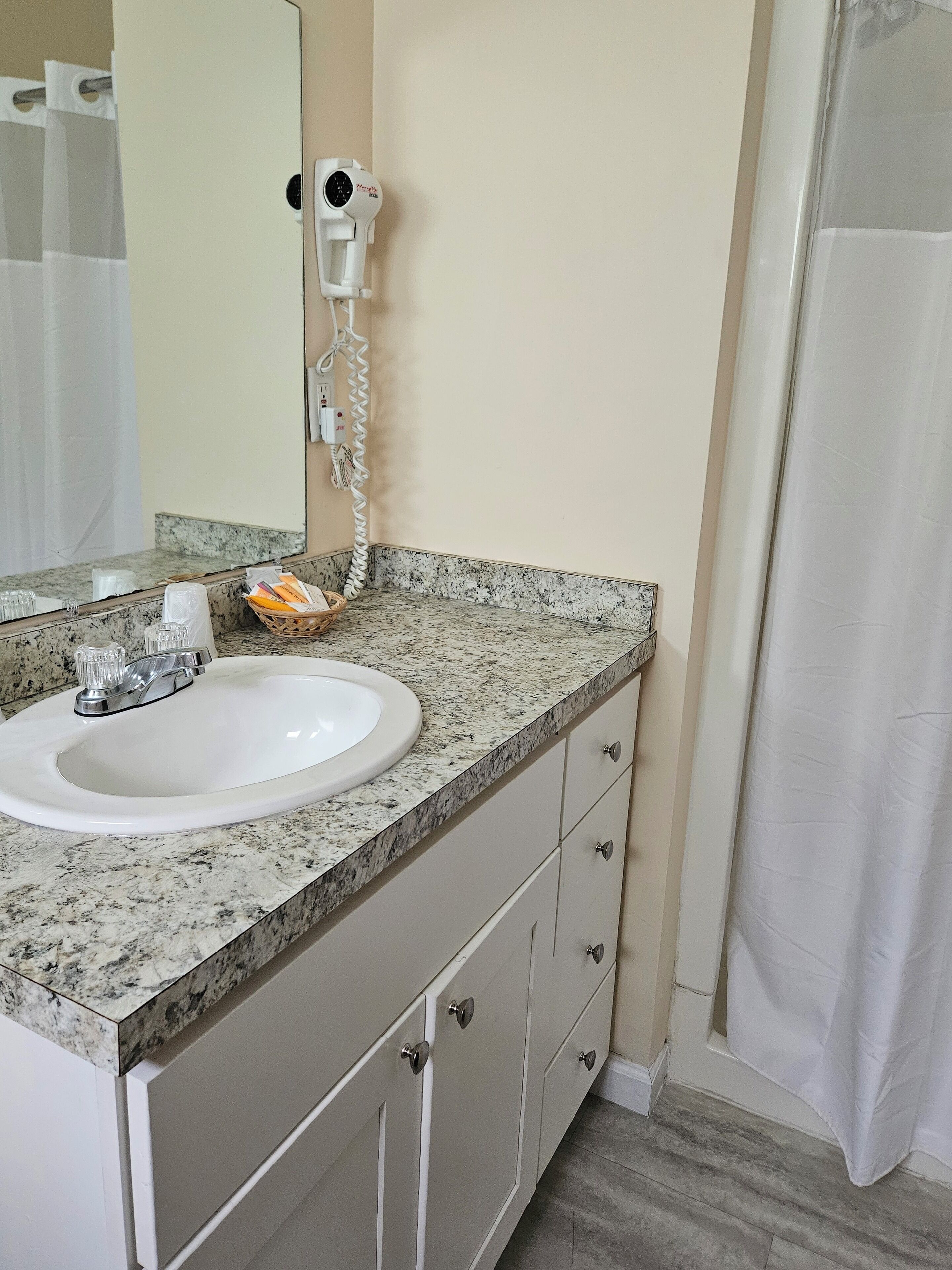 1 king bed efficiency with creek view deck | bathroom | hair dryer, towels